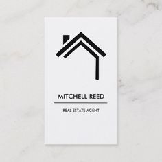 a white business card with the words mitchell reed real estate agent in black on it