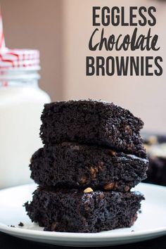 three chocolate brownies stacked on top of each other with the words eggless chocolate brownies above them