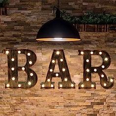 a sign that says bar with lights on it