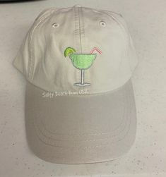 Margarita embroidery Baseball Cap Beach Hat in our popular pigment-dyed lived in or vintage look.  A summer must have and a perfect monogrammed gift for any occasion!  Bridesmaids Wedding Party Gifts, Graduations, Birthdays, and Christmas too. Create Your own vacation souvenir hat. Convo with your request. Additional fee may apply.  Tropical Logos vary in size.     Fabric: 100% garment washed cotton twill     Structure: Unstructured, 6-panel, low profile     Closure: fabric strap; metal buckle s Bachelorette Party Hat, Tropical Drink, Party Hat, Beach Hat, Monogram Gifts, Beach Bum, Gifts For Wedding Party, Girl With Hat, Dad Hat