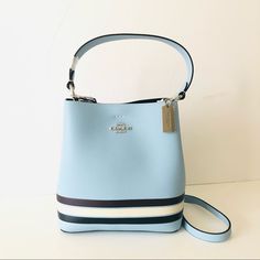 Nwt Coach Small Town Bucket Bag And In Colorblock With Stripe In Black And White Over Blue Pebbled Leather With Silver Hardware. This Convertible Bag Can Be Held In Hand Or Worn As A Shoulder Bag Or Crossbody Bag. Perfect As A Gift Or Daily Use. Color: Sv/Waterfall Midnight Multi Pocketbook Details: Polished Pebble Leather Center Zip Compartment Snap Closure Handle With 6 3/4" Drop Detachable Strap With 22" Drop For Shoulder Or Crossbody Wear 8 1/2" (L) X 8 3/4" (H) X 4" (W) Style No. C4080 Blue Bucket Shoulder Bag With Top Handle, Modern Blue Bucket Shoulder Bag, Blue Coach Shoulder Bag With Detachable Handle, Blue Coach Bags With Zipper Closure, Coach Blue Shoulder Bag With Silver-tone Hardware, Purse Boutique, Sequin Bag, Uniqlo Bags, Carryall Tote