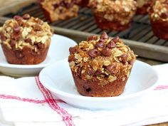 two white plates with muffins on top of them