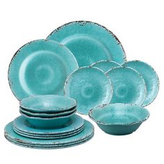 a set of teal dishes and cups with saucers on the bottom one is empty