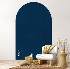 a living room with a white chair and blue arch on the wall next to it