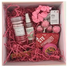 a pink box filled with lots of different items