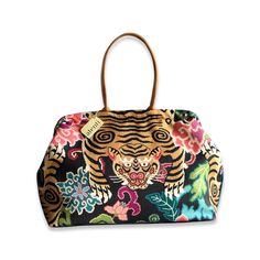 A fun floral cotton print with a Tiger placed perfectly to day hello! Opening with a 16" rectangular snap frame, the Atenti Pioneer carpet bag shows off a fully lined water resistant taffeta interior. Inside are a zippered pocket and an open divided pocket with a cell phone slot. The Pioneer has double 21” straps with a 10’ drop and metal feet. Made in United States Dimensions: 23 x 2 x 13 in Rectangular Travel Bags With Fabric Lining, Rectangular Travel Bag With Fabric Lining, Carpet Bag, A Cell, A Tiger, Medium Bags, Louis Vuitton Speedy Bag, Large Bags, Lalique