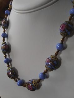 "Gorgeous, authentic Murano, vintage Venetian \"wedding cake\" glass bead handmade necklace with blue, pink, and aventurine flecked gold glass from Murano, Italy, 1970s. Beautiful blue beads of different shapes, with pink rose flowers and gold aventurine flecks threaded through the design of the large beads, alternating with smaller solid blue glass beads and gold-fill and brass spacer beads. Vintage Italian glass artistry from the 70s. A wonderful \"something blue\" for a bride, a perfect weddi Vintage Blue Glass Beads, Vintage Czech Glass Necklace With Polished Beads, Vintage Czech Glass Polished Beads Jewelry, Vintage Czech Glass Polished Beads Necklace, Vintage Czech Glass Jewelry With Polished Beads, Vintage Jewelry With Polished Czech Glass Beads, Vintage Czech Glass Necklaces With Polished Beads, Vintage Czech Glass Beaded Necklaces With Polished Beads, Vintage Necklace With Polished Beads