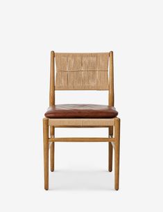 a wooden chair with brown leather seat padding and backrests, against a white background