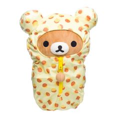 a teddy bear wearing a yellow and orange polka dot print cover with a zipper on it