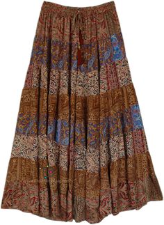 A beautiful multi-panel long skirt with a good fall and floral romantic red-brown and other prints.  The skirt has an elastic waist with a tassel drawstring. #tlb #Patchwork #MaxiSkirt #Printed #TieredSkirt #Summerskirt Fall Print Skirt, Brown Boho Skirt, Bohemian Brown Flared Skirt, Brown Flowy Bohemian Skirt, Vintage Long Brown Skirt, Brown Bohemian Long Skirt, Brown Patchwork Tiered Skirt, Bohemian Brown Patchwork Skirt, Brown Maxi Skirts