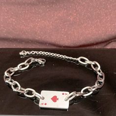 Stainless Steel Ace Of Spades Bracelet. Size: Around 7 Inches Long Plus 2 Inches Extender. Condition: Nwot. Packaging: Includes Cute Paper Box As Shown In The Picture. Red Metal Chain Bracelet Gift, Red Metal Chain Bracelet For Gift, Silver Metal Chain Bracelet For Valentine's Day, Valentine's Day Silver Metal Chain Bracelet, Adjustable Silver Chain Bracelet For Valentine's Day, Red Stainless Steel Bracelet For Gift, Ace Bracelet, Elizabeth Jewelry, Cute Paper