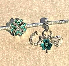 "Green Four Leaf Clover Crystal Charm for Bracelet ,  Lucky Symbol Shamrock Dangle Charm , Horseshoe , Heart , 925 Sterling Silver  CHOOSE : DOUBLE SIDED FOUR LEAF CRYSTAL CLOVER CHARM OR GREEN CLOVER DANGLE WITH CRYSTAL HORSESHOE AND SILVER HEART THAT HAS \" LUCKY SYMBOL \" ENGRAVED ON IT. Add this to your bracelet or as a gift. I do not accept returns. Sales are final unless damaged." Elegant Green Jewelry With Heart Charm, Green Double Heart Charm Jewelry, Green Heart Charm Jewelry For Valentine's Day, Green Heart Charm Jewelry, Horseshoe Heart, Four Leaf Clover Charm, Lucky Symbols, Green Clover, Clover Charm