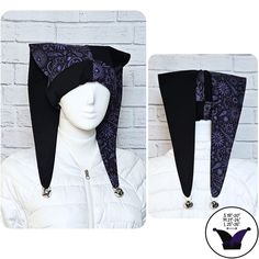 Orders ship within 2-3 weeks. Jester / harlequin hat in solid black and purple glittery celestial print.  Silver jingle bells on the ends. Hat is about 23 inches long from brim to ends. Made from 100% cotton, so it's lightweight and cool. Machine washable (though you may want to remove the bells first). Small fits head sizes 18" to 20". Medium fits head sizes 21" to 24". Large fits head sizes 25" to 26". Looking for a warmer version?  Solid color fleece version here: https://etsy.me/3IHT9ak Fitted Black Witchy Hat, Black Fitted Witchy Hat, Adjustable Purple Hat For Costume, Fitted Black Hat For Festival, Jester Accessories, Jester Fashion, Celestial Print, Jester Hat, Black And Purple