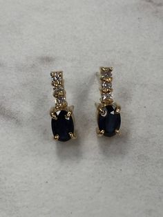 "14kt Yellow Gold Lady's Diamond and Sapphire Earrings consisting of 2- 6mm x 4mm oval genuine bright blue Sapphires 1.00ct approx total weight and 6 full cut round brilliant diamonds .18ct total weight SI1 clarity, G color all prong set with posts and friction backs. These earrings are 1/2\" in length and are the perfect day to day earrings to compliment any wardrobe. This item would Retail for $890.00" Classic Blue Oval Diamond Earrings, Classic Oval Sapphire Diamond Earrings, Oval Sapphire Earrings With Diamond Accents, Sapphire Earrings, Brilliant Diamond, Perfect Day, Gold Hoop, Gold Hoop Earrings, Bright Blue