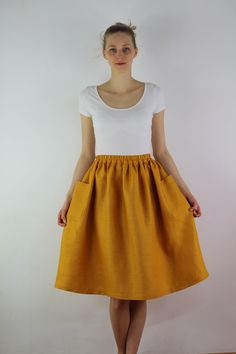 "Write the selected color in the message Handmade mustard linen midi skirt with зatch pockets on the sides, elastic waistband, perfect for casual wear and suitable for any occasion in any season Details: - 100% natural linen produced in Europe ; - medium weight (180 gram per square meter); - color: mustard, could be any from our colors catalog (color samples at the photo); Made to order, approximately a few days, If you have any questions please message me and I will be glad to answer. Size guid Spring Cotton Skirt With Slip Pockets, Relaxed Spring Skirt With Slip Pockets, Summer Bottoms With Pockets, Midi Length, Spring Midi Skirt With Side Pockets, Relaxed Summer Skirt With Slip Pockets, Summer Relaxed Skirt With Slip Pockets, Orange Midi Skirt For Summer, Summer Linen Skirt With Side Pockets, Flowy Midi Skirt With Pockets