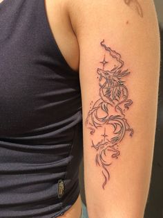 a woman's arm with a tattoo design on the left side of her body