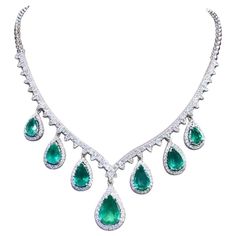 A magnificent necklace in elegant and refined design, so sophisticated , a very stunning style. Necklace come in 18k gold with 7 pieces of Natural Zambian Emeralds, in perfect pear cut, extra fine quality, spectacular vivid green, of 20,54 carats, and 258 pieces of Natural Diamonds in round brilliant cut of 6,24 carats , F color VS clarity, very sparkly. Handcrafted by artisan goldsmith. Excellent manufacture and quality of stones . Complete with AIG report. Whosale price . Note : on my shipment, no taxes. Luxury Multicolor Emerald Gemstone Necklace, Stunning Style, 18k Gold Necklace, Zambian Emerald, Multi Strand Necklace, Zambia, Dream Jewelry, Style Necklace, Gold Jewelry Fashion