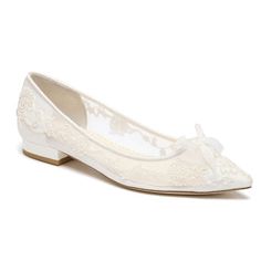 a pair of white shoes with bows on the toe and lace detailing, all in satin fabric