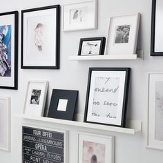 there are many framed pictures on the wall