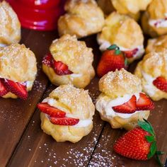 strawberry hand pies with powdered sugar and fresh strawberries on the wooden table