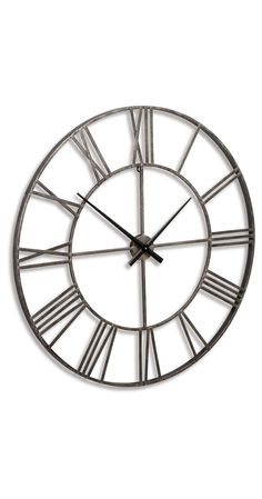 a large metal clock with roman numerals on it's face and hands