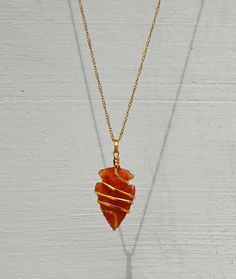 You are purchasing one handmade natural Carnelian crystal Arrowhead necklace pendant. These beautiful pendants are carefully cut, polished with care and have been personally chosen and selected under superior QC. We always prioritize the quality ahead and so as we use 100% genuine material in our Gemstones. ➤ Arrowhead Necklace size is Around 1 to 1.5 Inches What is Included? 1x Carnelian Spiral Arrowhead Necklace 1x Golden / Silver Chain for Women 1x Premium Adjustable Boho Cord for Men 1x Prem Red Hand Wrapped Necklace As Gift, Handmade Amber Crystal Necklace Gift, Handmade Amber Crystal Necklace For Gift, Hand Wrapped Red Necklace As Gift, Red Hand Wrapped Necklace For Gift, Arrowhead Wire Wrapped Necklaces For Gifts, Wire Wrapped Arrowhead Necklace For Gift, Agate Crystal Pendant Necklace As Gift, Agate Pendant Crystal Necklace For Gift