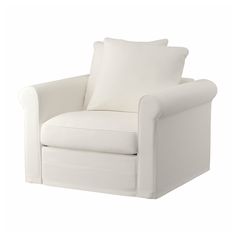 a white chair with two pillows on it