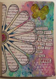 an art journal with flowers and words on it, including the word i love you free