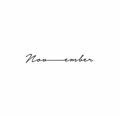 a black and white photo with the word nom - ember written in cursive ink