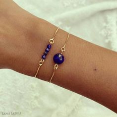 This dainty set of two bracelets features genuine Lapis Lazuli stones and 18k gold filled chain box Bracelets are 9 inches long and are adjustable. Just slide the gold bead for best fit. Fits most! STONE 1 Lapis Lazuli ball aprox 10mm 3 mini Lapis Lazuli ball aprox 2 mm CHAIN AND METAL All our chains are made of 18k gold filled. 18k gold filled jewelry is created with a thick layer of 18k solid gold over a metal core. Gold filled jewelry is a beautiful, affordable alternative to solid gold, and Royal Blue Jewelry, Box Bracelets, Blue Gemstone Bracelet, Metal Core, Lapis Lazuli Bracelet, Lapis Lazuli Beads, Lapis Lazuli Stone, Bracelet Blue, Blue Jewelry