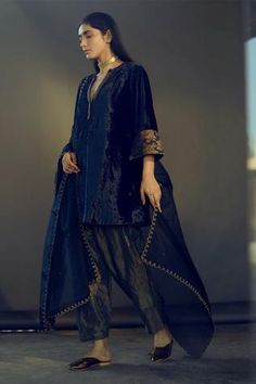 Navy velvet flared kurta with sequin motifs and embroidered floral motifs on sleeve hems. Comes with salwar.
Components:2
Embroidery
Neckline:Notched
Sleeve Length:Three fourth
Fabric:Kurta: Velvet; Pant: Handloom Tissue
Color:Blue
Hand embroidered knot stitches
Note: Dupatta worn by model is not for sale. - Aza Fashions Earth Clothes, Velvet Kurta, Velvet Pant, Indian Kurti Designs, Gown With Dupatta, Blue Organza, Blue Kurta, Velvet Flares, Pakistani Fashion Party Wear