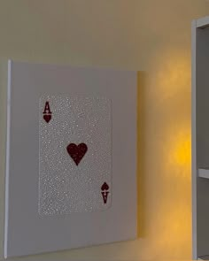 a white shelf with some cards on it