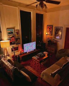 a living room filled with furniture and a flat screen tv