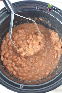 how to make homemade refried beans in the crock pot with text overlay