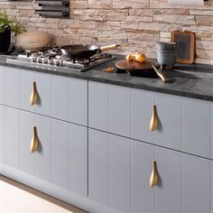 an image of a kitchen setting with food on the counter and cooking utensils