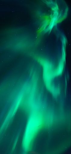 an aurora bore in the sky with green lights