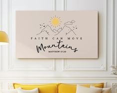 a living room with a yellow couch and white walls that says faith can move mountains