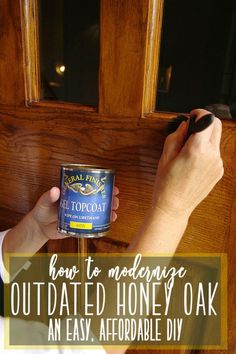 a person holding a can of food with the words how to modling outdated honey oak an easy, affordable diy