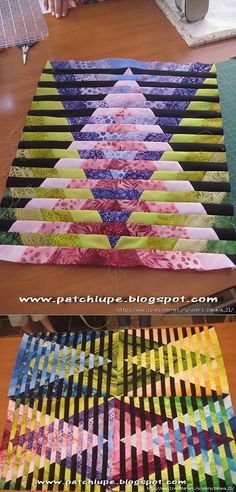 two rows of quilts sitting on top of a wooden table