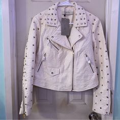 Super Cute Edgy White Studded Leather Jacket Beautiful Design Fashionable Style (Check All Pictures For Imperfections) Factory/Store Flaws Size L Perfect For Dates Date Night Bikers Summer Resorts Hotels Fancy Events Weddings Parties Casinos Las Vegas Everywhere!Get Your Holiday Shopping! Bundle And Save!! Items May Come With Few Stray Cat Hairs I Try My Best To Clean Them Before Shipping Any More Questions Please Ask!! Price Firm!!!!!!!!!!!!!! Winter White Leather Jacket With Long Sleeves For Fall, Studded Leather Jacket For Party, Casual White Leather Jacket For Winter, Fitted Zara Biker Jacket For Spring, Trendy White Leather Jacket With Long Sleeves, Winter White Leather Jacket For Fall, Casual White Leather Winter Jacket, White Biker Jacket With Zipper For Spring, White Long Sleeve Biker Jacket For Winter