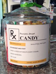 a jar filled with candy sitting on top of a counter