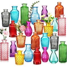 many different colored vases with flowers in them