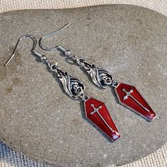 Add An Edgy Touch To Your Outfit With These Asymmetrical Dangle/Drop Earrings From Cascade Jewelry. The Blood Red Enamel Coating And Pewter Base Metal Create A Gothic, Punk, And Bohemian Vibe. These Earrings Feature A Vampire Coffin And Hanging Bat Design With A Silver Cross Accent, Making Them Perfect For Those Who Love Art, Retro Style, And Costumes. The Hook Closure And Stainless Steel Metal Ensure Durability, While The 11 Mm Item Diameter And 71 Mm Item Length Make Them Suitable For Lobe Ear Vampire Coffin, Coffin Earrings, Red Vampire, Hanging Bat, Bat Design, Gold Bead Earrings, Glass Drop Earrings, Earrings Handmade Dangle, Gem Jewelry