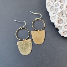 Hammered Brass Dangle Earrings 14k plated brass, hypoallergenic and nickel free ear hooks These dainty brass earrings measure 2 inches long Brass has been sealed to prevent tarnish Earrings come with clear backs and muslin bags Earrings Dangle Simple, Dangle Earrings Boho, Muslin Bags, Ear Hook, Simple Jewelry, Brass Earrings, Etsy Earrings Dangle, Boho Earrings, Jewelry Earrings Dangle