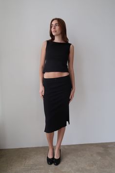 HERR BY ISABELA DEMI MIDI SKIRT Low/mid-rise black midi skirt with two slits on each side and a black mini ribbon bow. Responsibly made in Los Angeles, CA. DETAILS 95% cotton 5% spandex care instructions- machine wash in cold water, tumble dry low, no bleach Kaylee is wearing size xs If you are in between sizes, we recommend sizing down. See size guide for sizing information Black Mesh Skirt Outfit, Midi Pencil Skirt Outfit, 90s Minimalism Fashion, Mid Skirt Outfits, Black Midi Skirt Outfit, 90s Midi Skirt, Black Skirt Outfits, Midi Skirt Outfit, Pencil Skirt Outfits