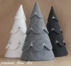 three small felt christmas trees in different colors