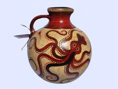 a vase with an octopus painted on it