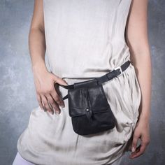 "This Vintage Style Fanny Pack is a small And Unique Hip bag Black Retro Hip Bag simple and beautiful Small fanny pack, it's made from high quality Black Waxed Canvas And Black leather, which is soft to touch, strong, durable and a very fine material. Top grade thicker leather is used for the adjustable long strap belt black leather bag This Retro Style hip bag features one separate compartment closed by a zipper in the back side so you can securely carry passports, cash, phone, and any other va Daily Use Shoulder Belt Bag, Daily Use Belted Shoulder Belt Bag, Travel Crossbody Bag With Belt Detail, Everyday Pouch Shoulder Bag With Belt Detail, Everyday Belted Pouch Shoulder Bag, Travel Pouch Bag With Belt Detail, Everyday Belt Pouch Bag, Belted Pouch Bag For Everyday Use, Travel Pouch Bag With Belt