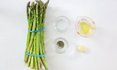 the asparagus are ready to be cut and put into small bowls with measuring tape