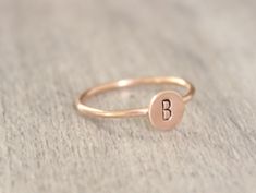 Simple initial stacking ring. Made with 14k gold filled or sterling silver. Please put your initial request in the notes at checkout. This ring is made to order in your size. If you don't see your size available please feel free to message me. All orders ship in a gift box. If you are ordering multiple items and want them boxed separately, please let me know in the notes at checkout. I ship via USPS. Please review the estimated delivery date and processing times. Processing times vary based on h Dainty Rose Gold Sterling Silver Initial Ring, Minimalist Initial Rose Gold Ring, Rose Gold Initial Ring Stamped 14k For Gift, Dainty Rose Gold Initial Ring Stamped 14k, Everyday Rose Gold Initial Ring In Sterling Silver, Everyday Rose Gold Sterling Silver Initial Ring, Simple Rose Gold 14k Gold Initial Ring, Personalized Dainty Initial Ring In Rose Gold, Personalized Dainty Rose Gold Initial Ring